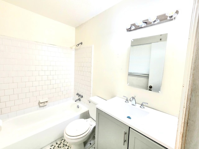 full bathroom with vanity, toilet, and tiled shower / bath combo