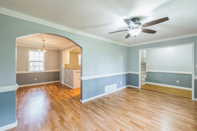 4572 Colonial Rd, Martinez, GA 30907 - spare room with a ceiling fan, light wood-style floors, arched walkways, baseboards, and ornamental molding