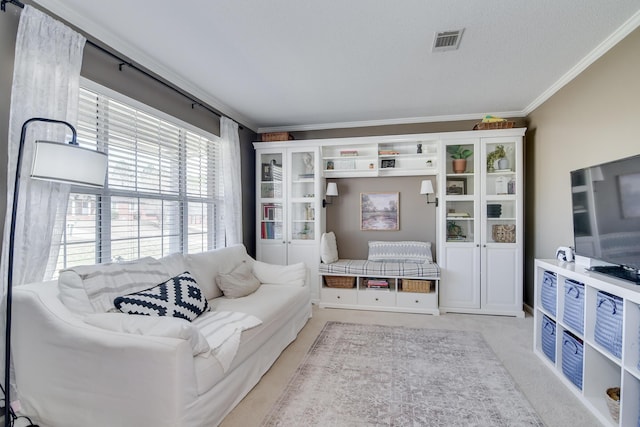 living room with light colored carpet, visible vents, and crown molding