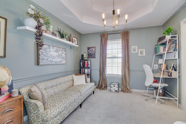 office area with light carpet, baseboards, a raised ceiling, ornamental molding, and a chandelier