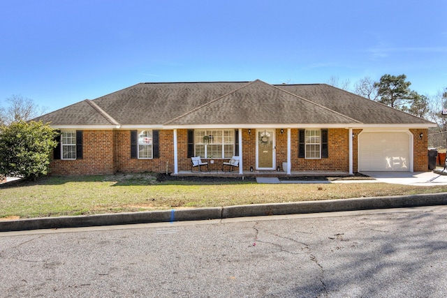 ranch-style house featuring covered porch, brick siding, roof with shingles, and an attached garage