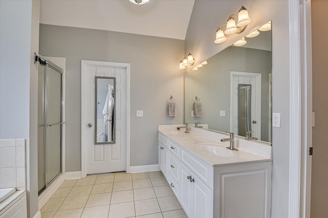 1176 Sumter Landing Cir, Evans, GA 30809 - bathroom with tile patterned floors, double vanity, an enclosed shower, and a tub