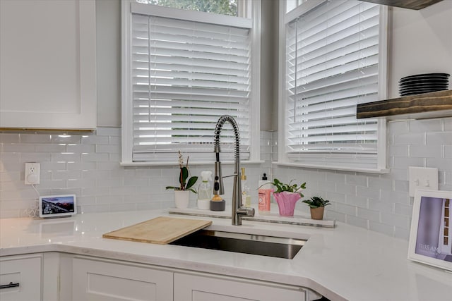 1176 Sumter Landing Cir, Evans, GA 30809 - kitchen with white cabinetry, tasteful backsplash, and light countertops