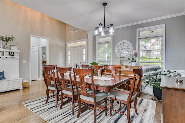 1176 Sumter Landing Cir, Evans, GA 30809 - dining space featuring light wood-style floors, healthy amount of natural light, and ornamental molding
