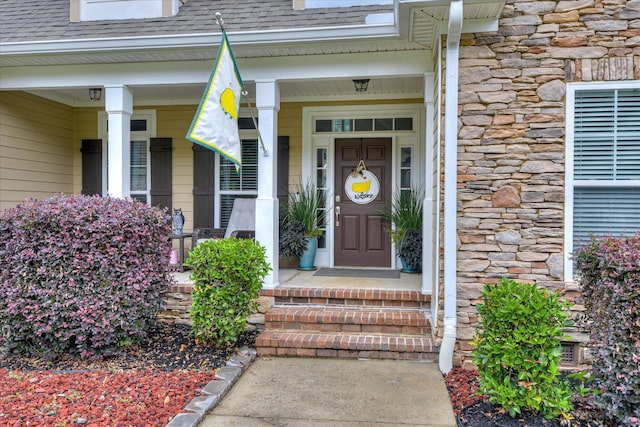 1176 Sumter Landing Cir, Evans, GA 30809 - entrance to property with a shingled roof, stone siding, and a porch