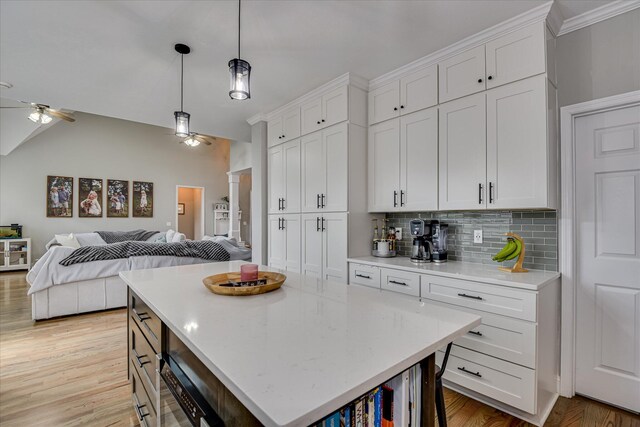 1176 Sumter Landing Cir, Evans, GA 30809 - kitchen featuring ceiling fan, open floor plan, tasteful backsplash, and white cabinetry