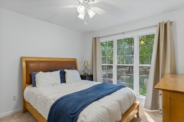 bedroom featuring carpet flooring, baseboards, and a ceiling fan