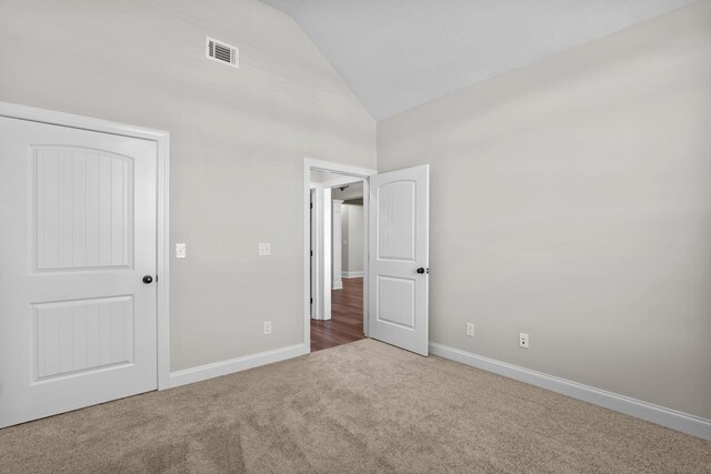 1253 Elbron Dr, Augusta, GA 30909 - unfurnished bedroom with carpet floors, high vaulted ceiling, and baseboards