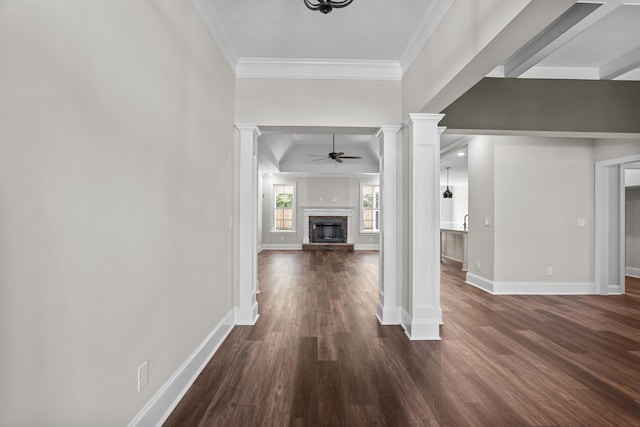 1253 Elbron Dr, Augusta, GA 30909 - unfurnished living room with decorative columns, a ceiling fan, a stone fireplace, crown molding, and dark wood finished floors