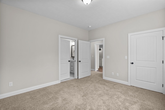 1253 Elbron Dr, Augusta, GA 30909 - unfurnished bedroom featuring carpet flooring, baseboards, and ensuite bath