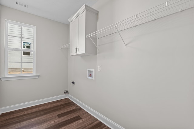 1253 Elbron Dr, Augusta, GA 30909 - laundry area with hookup for a washing machine, baseboards, dark wood-style flooring, cabinet space, and electric dryer hookup