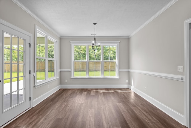 1253 Elbron Dr, Augusta, GA 30909 - unfurnished dining area with dark wood-type flooring, baseboards, ornamental molding, a chandelier, and a textured ceiling