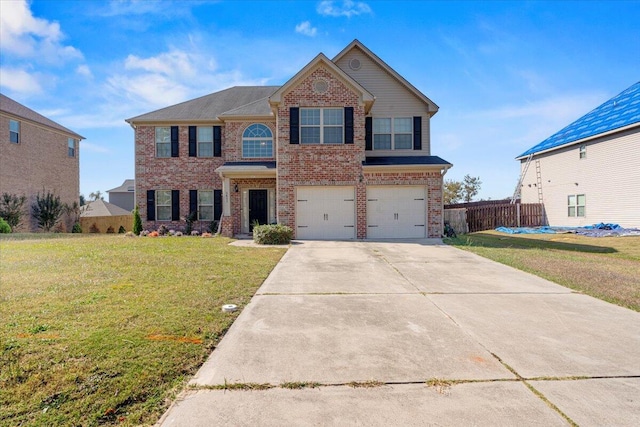 view of front facade with a front yard and a garage