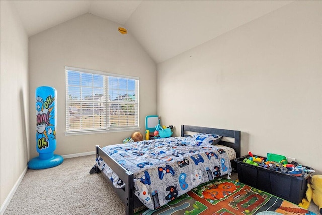 carpeted bedroom with lofted ceiling