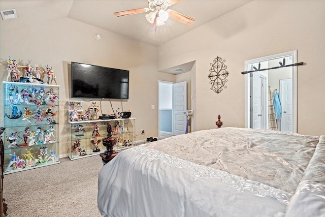 bedroom featuring carpet, ceiling fan, lofted ceiling, and ensuite bathroom