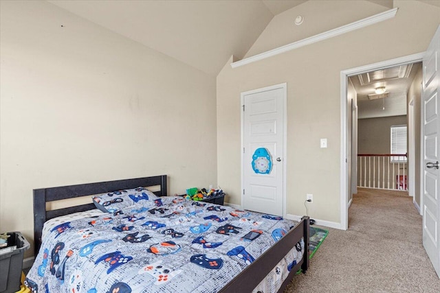 carpeted bedroom with vaulted ceiling