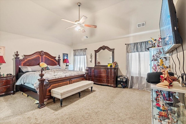 bedroom with carpet flooring, ceiling fan, lofted ceiling, and multiple windows