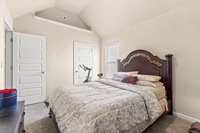 carpeted bedroom featuring lofted ceiling