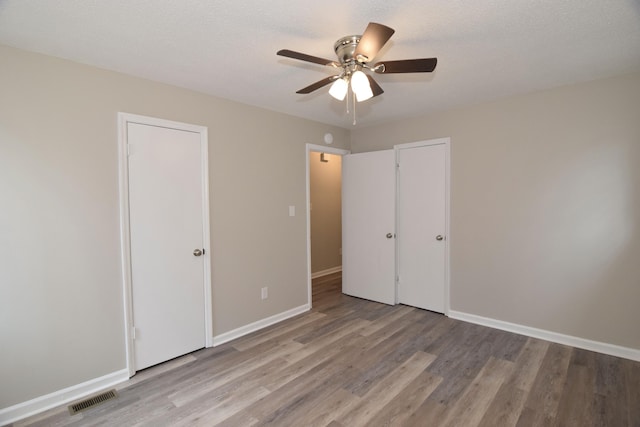 3528 Bullock Ave, Augusta, GA 30906 - unfurnished bedroom featuring light wood-style flooring, baseboards, and ceiling fan