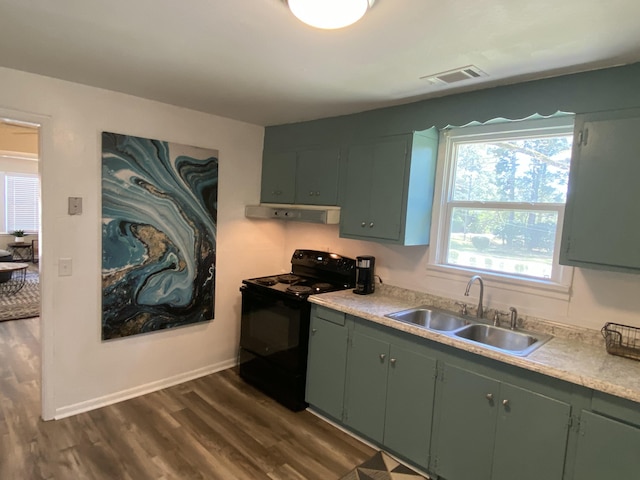 kitchen featuring green cabinets, black electric range oven, and sink