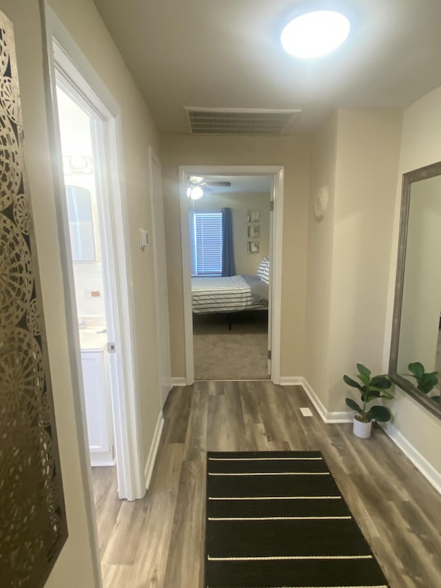 corridor featuring hardwood / wood-style flooring