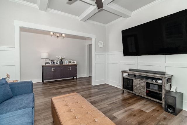 living area with beam ceiling, coffered ceiling, a decorative wall, and wood finished floors