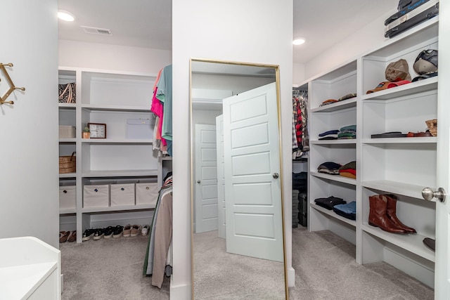 spacious closet with light carpet and visible vents