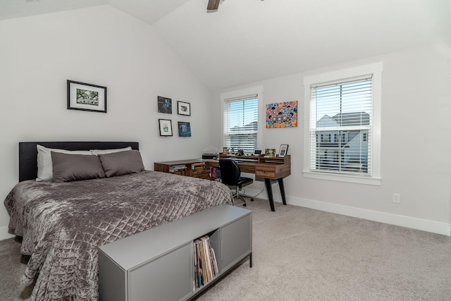 bedroom with light carpet, ceiling fan, vaulted ceiling, and baseboards