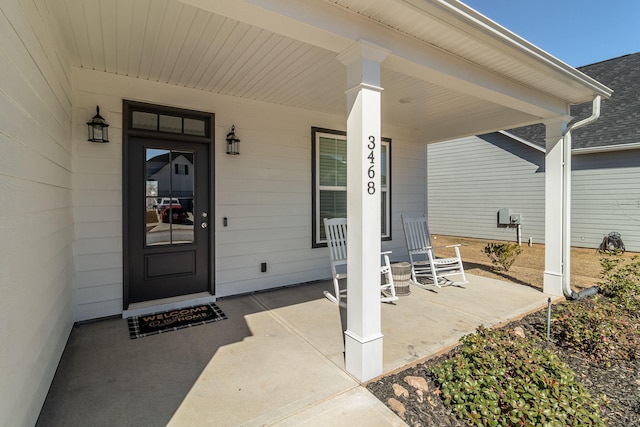 property entrance with covered porch