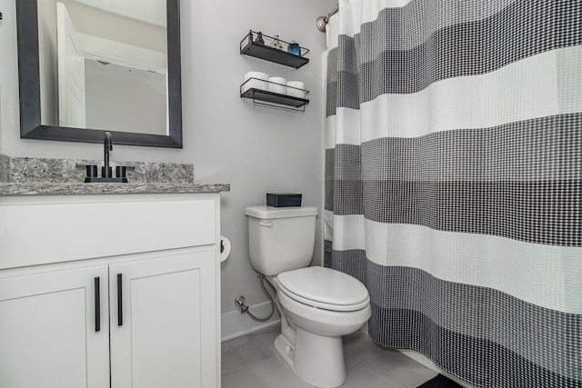 full bath with toilet, vanity, baseboards, and tile patterned floors