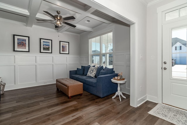 living room with dark wood-style floors, beamed ceiling, coffered ceiling, and a decorative wall