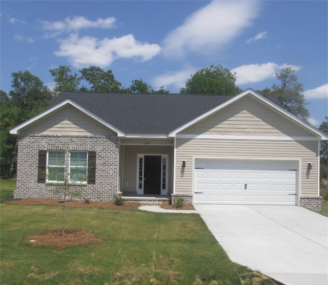 ranch-style home with a garage and a front lawn