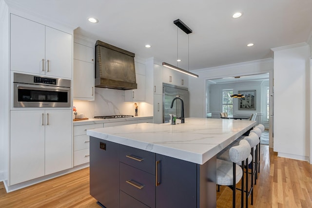 3489 Evans To Locks Rd, Martinez, GA 30907 - kitchen with stainless steel appliances, crown molding, modern cabinets, a kitchen breakfast bar, and white cabinetry
