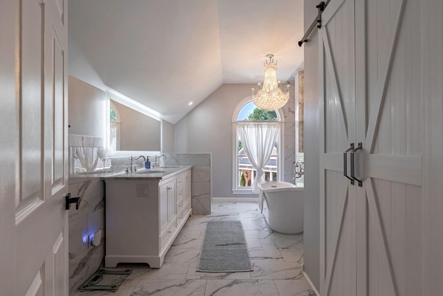 3489 Evans To Locks Rd, Martinez, GA 30907 - bathroom with marble look tile flooring, vanity, a chandelier, a freestanding bath, and lofted ceiling