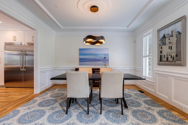 3489 Evans To Locks Rd, Martinez, GA 30907 - dining room with light wood-type flooring, a decorative wall, a wainscoted wall, a chandelier, and ornamental molding