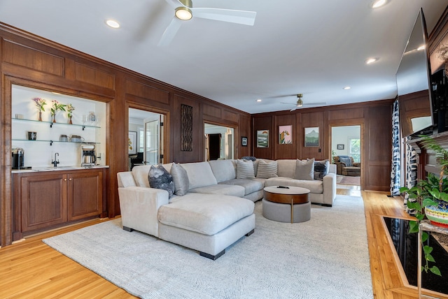 3489 Evans To Locks Rd, Martinez, GA 30907 - living room featuring a ceiling fan, wood walls, light wood-style flooring, crown molding, and recessed lighting