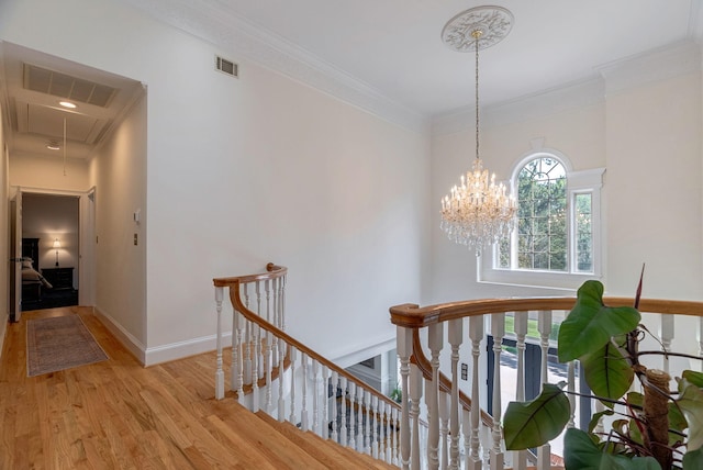 3489 Evans To Locks Rd, Martinez, GA 30907 - hall featuring an upstairs landing, attic access, light wood finished floors, ornamental molding, and a chandelier