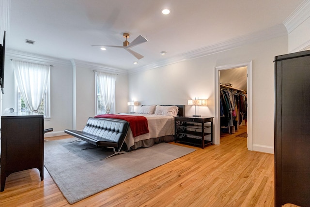 3489 Evans To Locks Rd, Martinez, GA 30907 - bedroom with crown molding, a walk in closet, light wood-type flooring, recessed lighting, and ceiling fan
