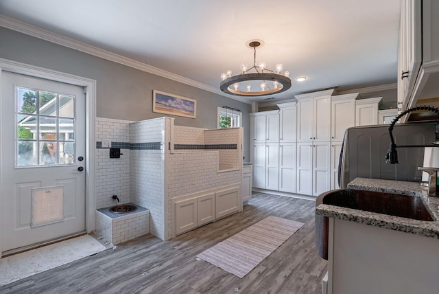 3489 Evans To Locks Rd, Martinez, GA 30907 - kitchen featuring a chandelier, ornamental molding, white cabinetry, dark wood-style floors, and light stone counters