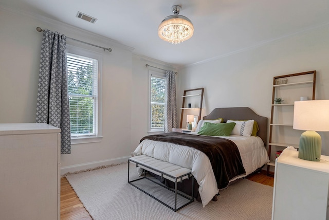 3489 Evans To Locks Rd, Martinez, GA 30907 - bedroom with multiple windows, light wood-style floors, a chandelier, and crown molding