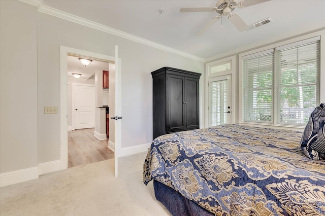 bedroom featuring ceiling fan, crown molding, and light carpet