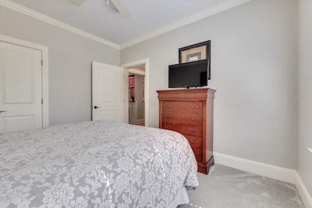 carpeted bedroom with ceiling fan and ornamental molding