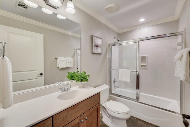 full bathroom with tile patterned flooring, enclosed tub / shower combo, toilet, vanity, and ornamental molding