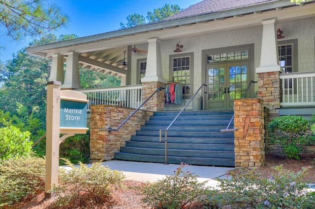 view of exterior entry with covered porch