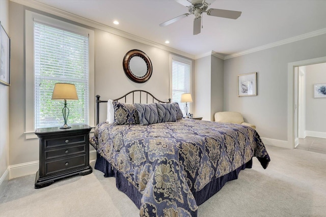 bedroom with multiple windows, light colored carpet, ceiling fan, and ornamental molding