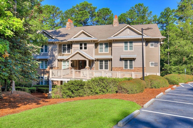 view of front of house with a wooden deck