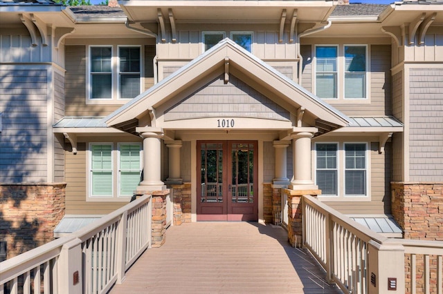 view of exterior entry featuring french doors