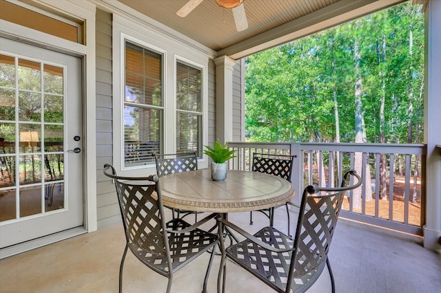 sunroom / solarium with ceiling fan and wooden ceiling