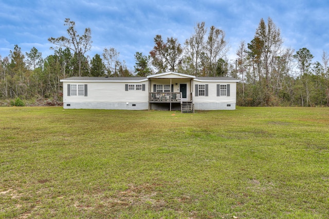 back of house with a porch and a yard