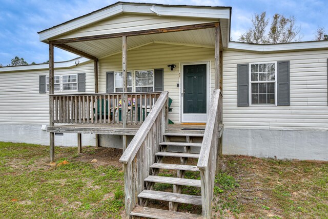 doorway to property featuring covered porch